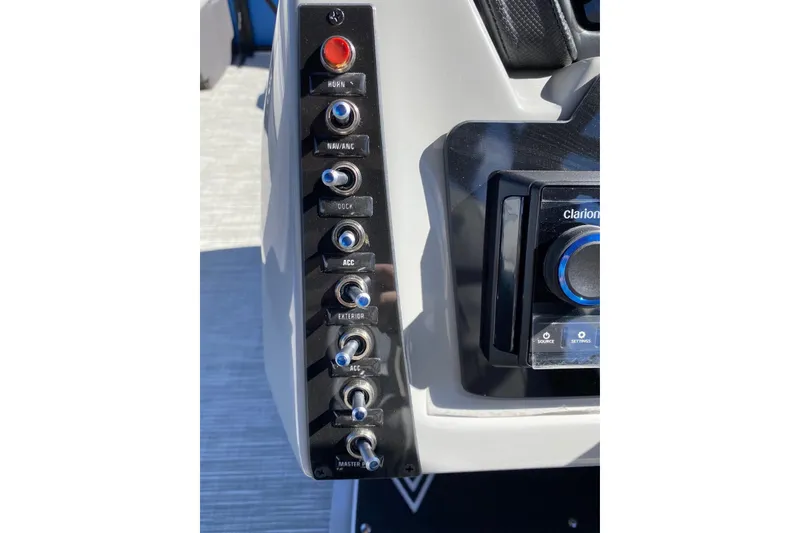 Slide: The Image of Control panel of 2024 Viaggio Lago 20C boat with switches and audio system. - 8
