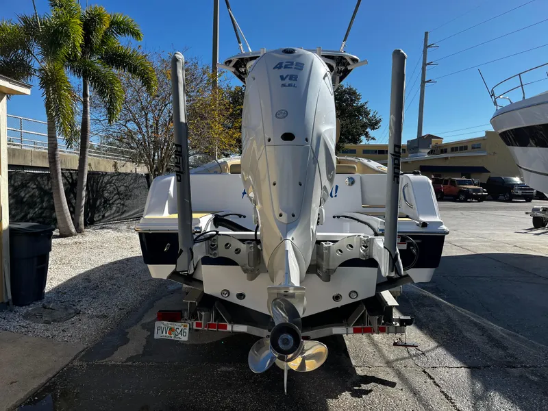Slide: The Image of 2021 Sportsman Heritage 251 Center Console boat on trailer, rear view. - 2