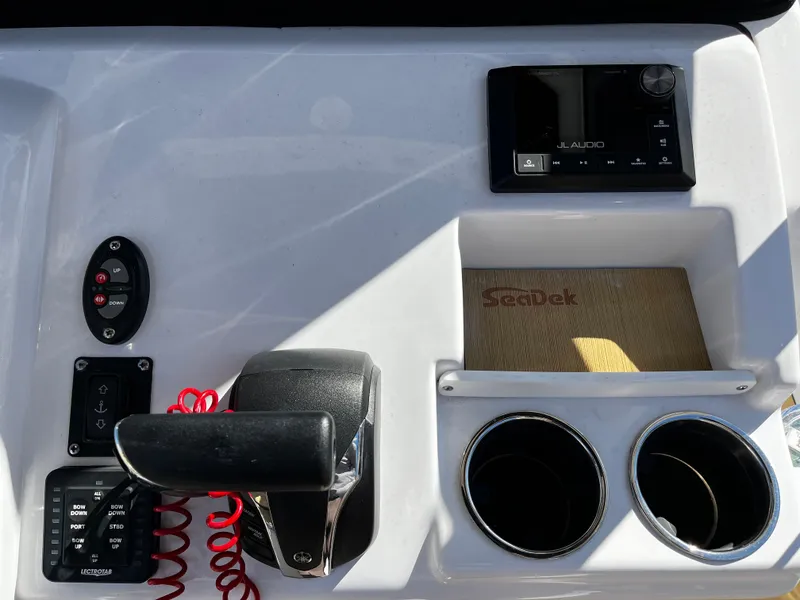 Slide: The Image of Control panel of a 2021 Sportsman Heritage 251 Center Console boat. - 23