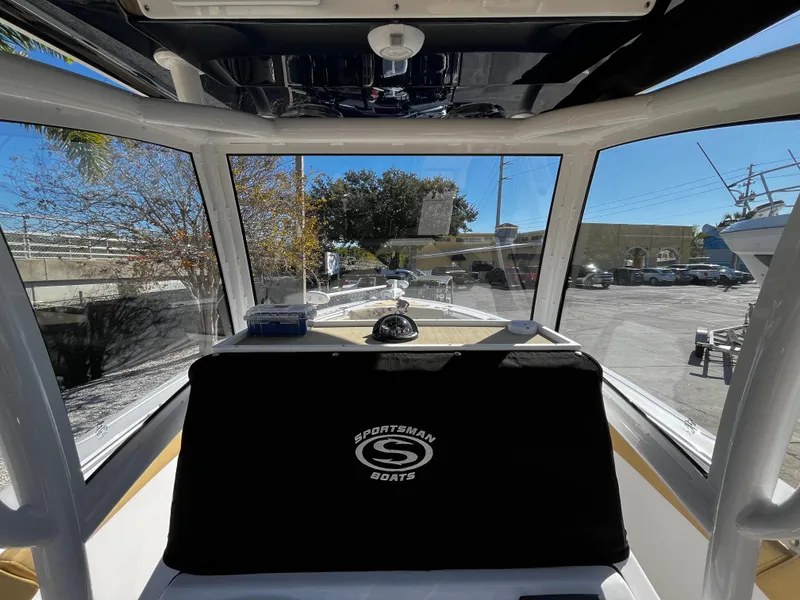 Slide: The Image of 2021 Sportsman Heritage 251 Center Console interior view with windshield and dashboard. - 26