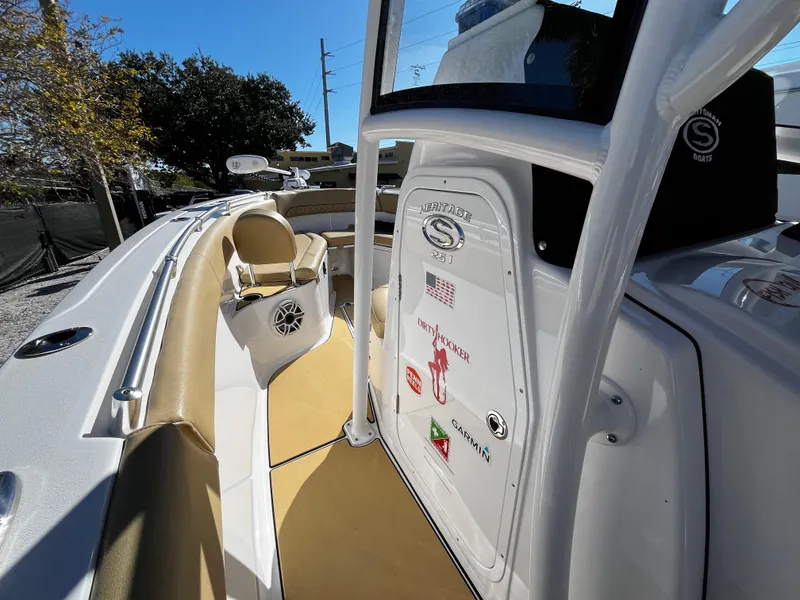 Slide: The Image of 2021 Sportsman Heritage 251 Center Console boat interior with seating and console. - 27