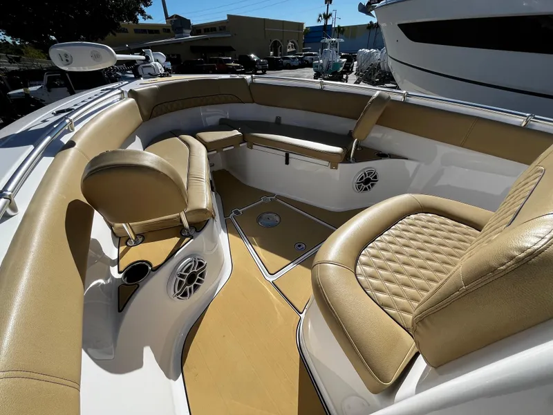 Slide: The Image of 2021 Sportsman Heritage 251 Center Console boat with tan seating and spacious deck. - 32