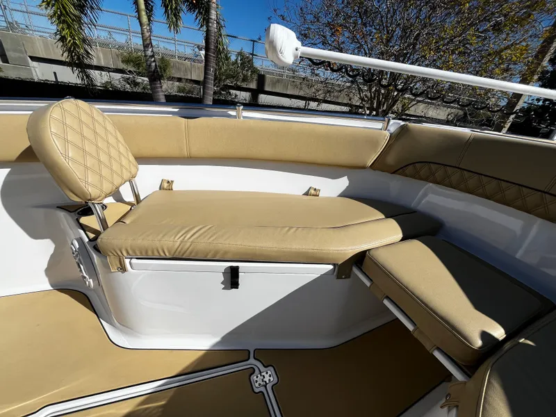 Slide: The Image of 2021 Sportsman Heritage 251 Center Console boat with tan cushioned seating. - 33