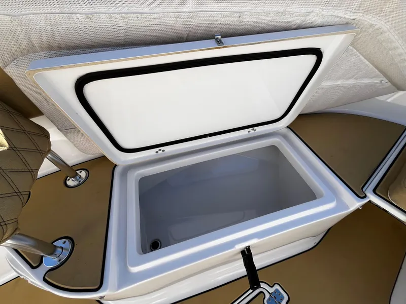 Slide: The Image of Open storage compartment on a 2021 Sportsman Heritage 251 Center Console boat. - 35