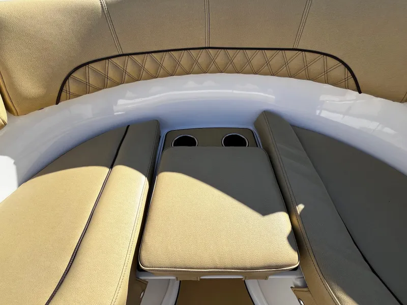 Slide: The Image of 2021 Sportsman Heritage 251 Center Console boat seating area with cup holders - 36