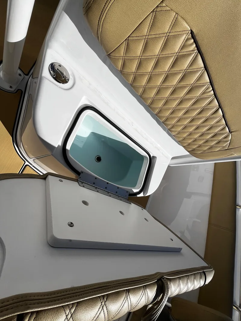 Slide: The Image of 2021 Sportsman Heritage 251 Center Console boat interior with tan diamond-stitched seats. - 41