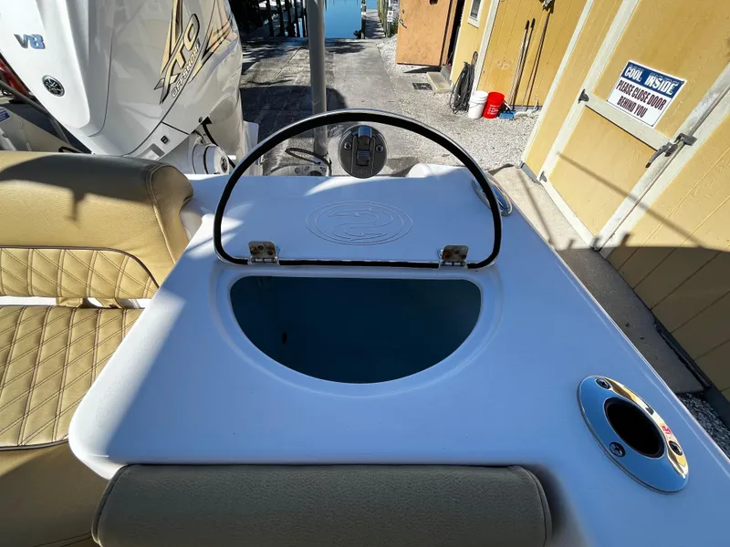 Slide: The Image of 2021 Sportsman Heritage 251 Center Console livewell and seating area. - 8