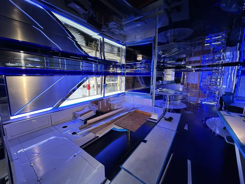 Slide: The Image of Luxurious interior of 1992 Heesen 141 Motor Yacht with modern blue lighting. - 11