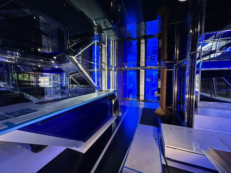 Slide: The Image of Luxurious interior of 1992 Heesen 141 Motor Yacht with modern blue lighting. - 12
