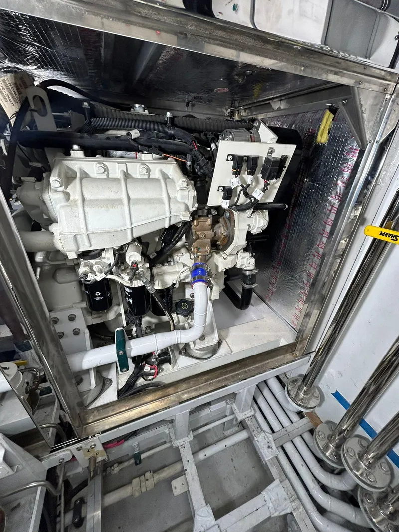 Slide: The Image of Engine room of 1992 Heesen 141 Motor Yacht, showcasing mechanical components and piping. - 14