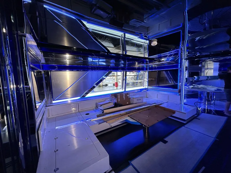 Slide: The Image of Luxurious interior of 1992 Heesen 141 Motor Yacht with modern blue lighting. - 16