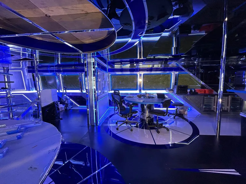 Slide: The Image of Futuristic interior of 1992 Heesen 141 Motor Yacht with blue LED lighting and modern furnishings. - 20