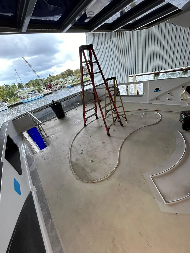 Slide: The Image of Heesen 141 Motor Yacht 1992 deck under maintenance with ladder and tools. - 23