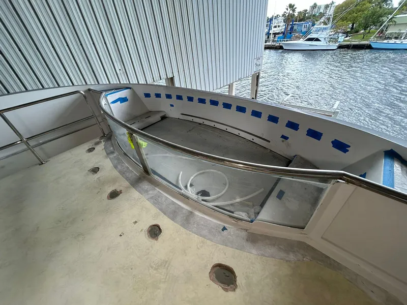 Slide: The Image of Heesen 141 Motor Yacht 1992, deck view with railing and waterfront backdrop. - 25