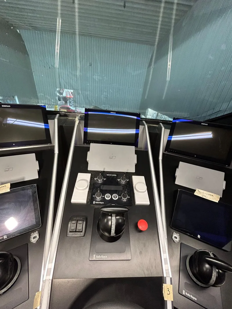 Slide: The Image of Control panel of a 1992 Heesen 141 Motor Yacht with multiple screens and controls. - 32