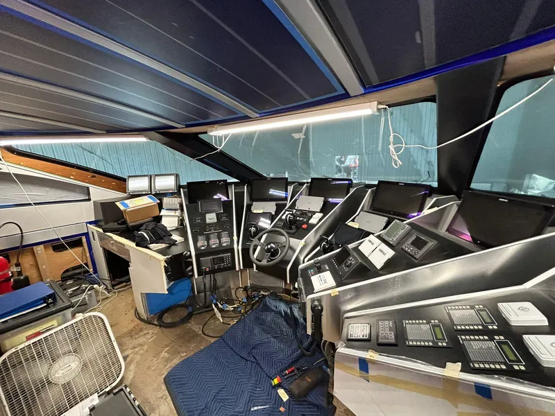Slide: The Image of Cockpit of 1992 Heesen 141 Motor Yacht with control panels and navigation equipment. - 33