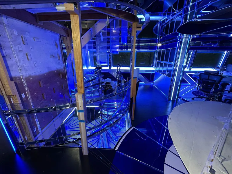 Slide: The Image of Interior of 1992 Heesen 141 Motor Yacht with modern blue lighting and spiral staircase. - 37