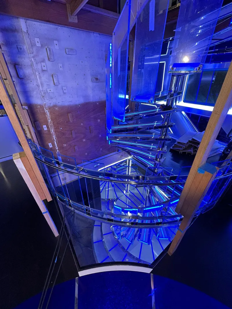 Slide: The Image of Spiral staircase with blue lighting inside a 1992 Heesen 141 Motor Yacht. - 39
