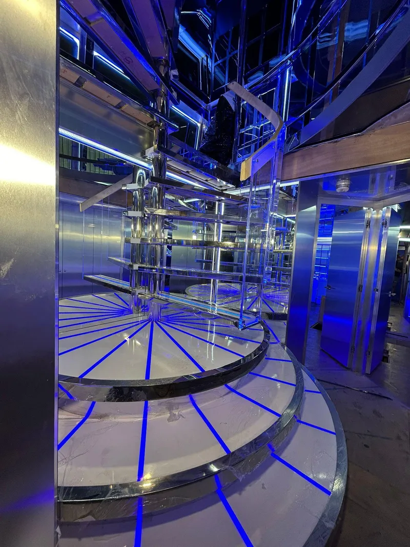 Slide: The Image of Luxurious spiral staircase with blue LED lighting on a 1992 Heesen 141 Motor Yacht. - 41