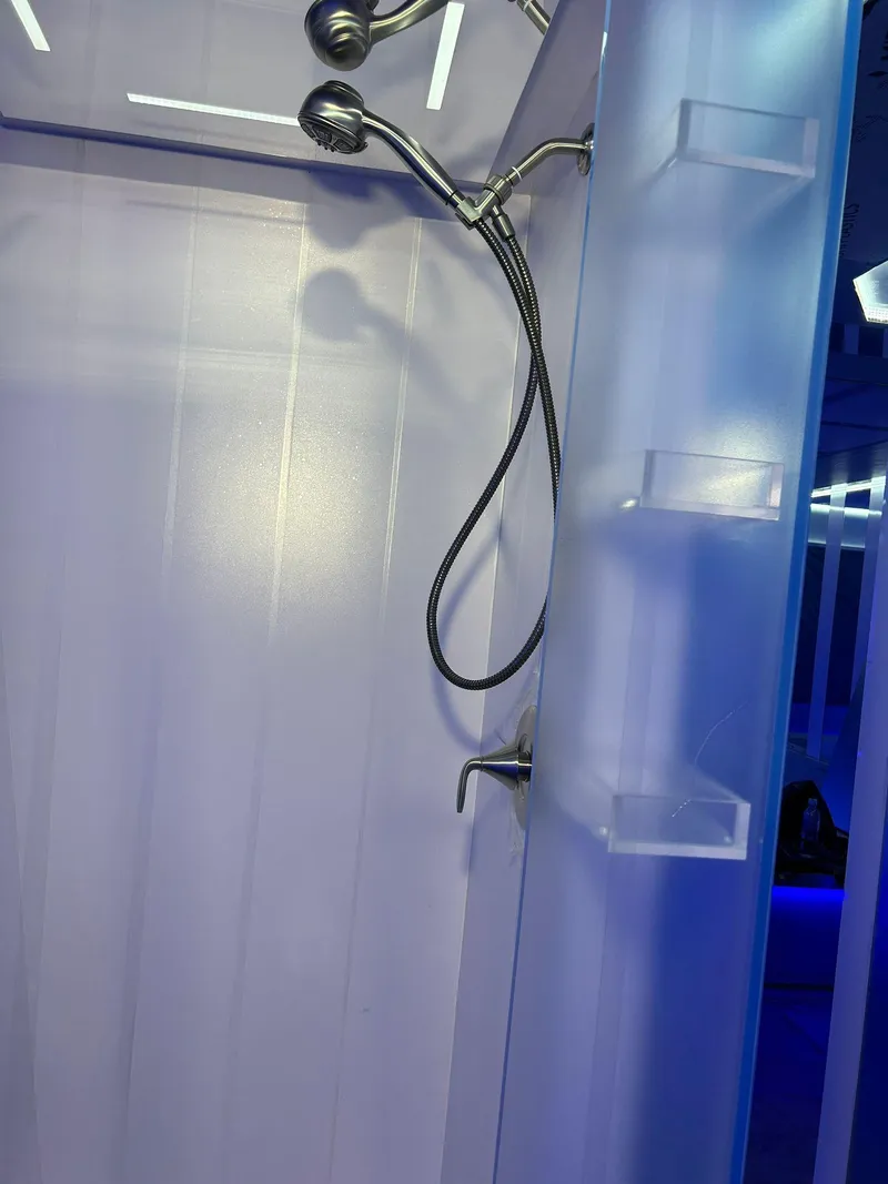 Slide: The Image of Shower area inside 1992 Heesen 141 Motor Yacht with modern fixtures and blue lighting. - 45