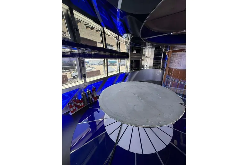 Slide: The Image of Interior of 1992 Heesen 141 Motor Yacht with modern design and large windows. - 88