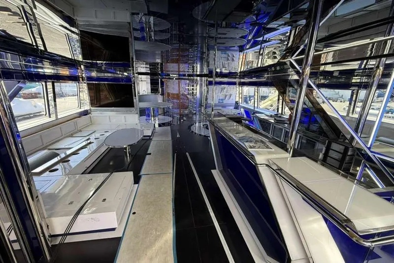 Slide: The Image of Luxurious interior of 1992 Heesen 141 Motor Yacht with modern design and blue accents. - 89