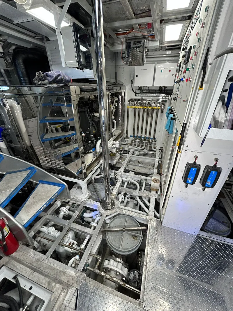 Slide: The Image of Engine room of 1992 Heesen 141 Motor Yacht with complex machinery and control panels. - 9