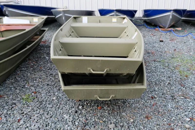 Slide: The Image of 2024 Crestliner 1436L CR Jon boat on gravel lot, front view. - 4