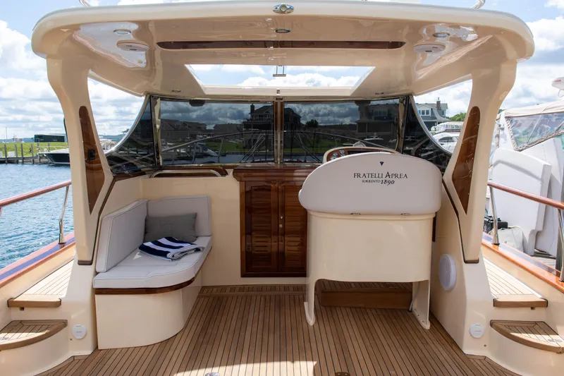 Slide: The Image of Fratelli Aprea Sorrento 32, 2020 model, elegant boat interior with wooden accents. - 10