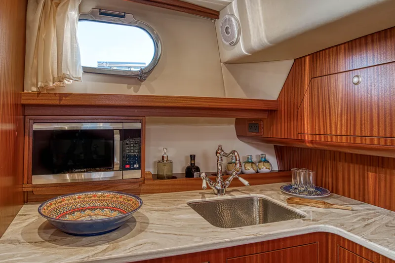 Slide: The Image of Luxurious kitchen interior of 2020 Fratelli Aprea Sorrento 32 yacht with wooden cabinetry. - 17