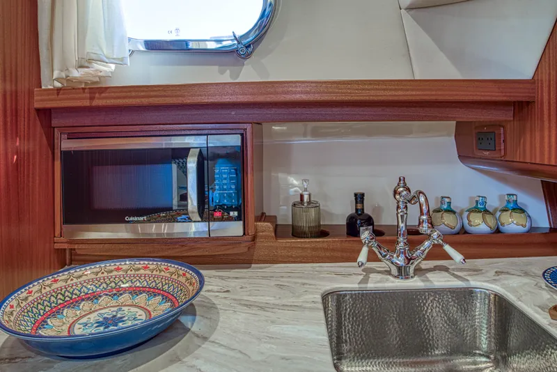 Slide: The Image of Fratelli Aprea Sorrento 32 yacht kitchen with microwave, sink, and decorative bowl, 2020 model. - 18