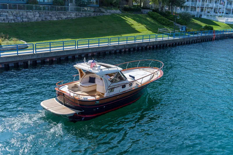 Slide: The Image of 2020 Fratelli Aprea Sorrento 32 boat cruising on a clear blue waterway. - 24