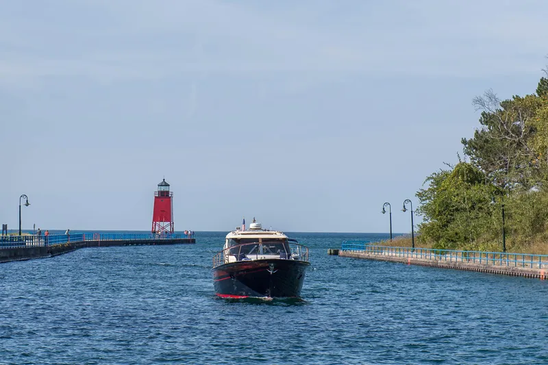 Slide: The Image of Fratelli Aprea Sorrento 32 boat near a red lighthouse on a sunny day, 2020. - 32