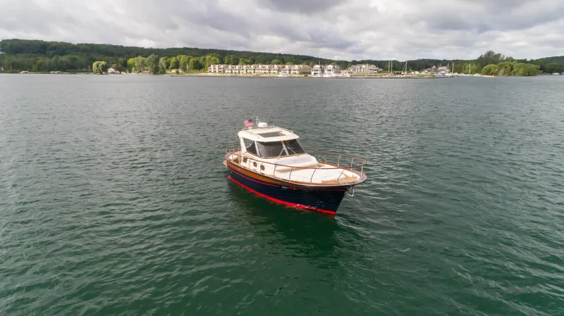 Slide: The Image of Fratelli Aprea Sorrento 32 boat on calm water, 2020 model, scenic background. - 34