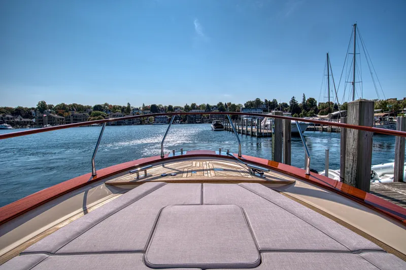 Slide: The Image of Fratelli Aprea Sorrento 32 yacht, 2020 model, docked in a serene marina setting. - 39