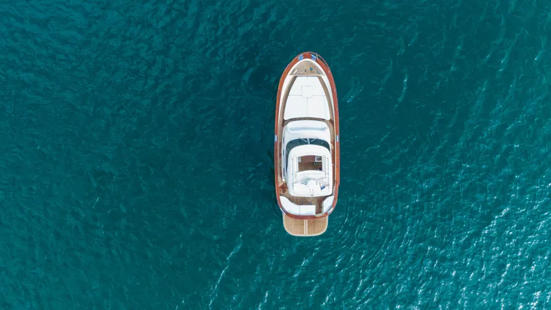 Slide: The Image of Aerial view of 2020 Fratelli Aprea Sorrento 32 yacht on blue ocean water. - 42