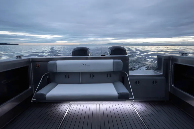 Slide: The Image of Jasper Marine Defender 22 boat, 2025 model, with sleek seating and ocean view. - 24