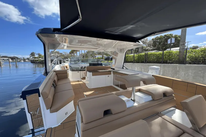 Slide: The Image of 2024 Aviara AV40 Outboard luxury boat interior with spacious seating and modern design. - 11