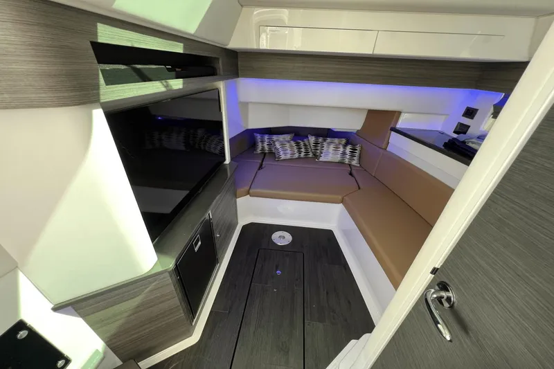Slide: The Image of Luxurious interior of 2024 Aviara AV40 Outboard with modern seating and ambient lighting. - 20