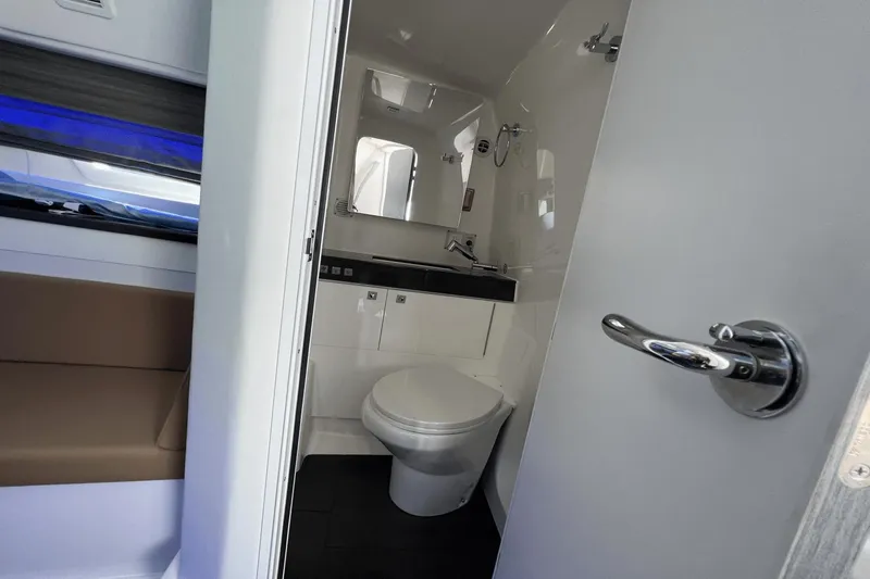 Slide: The Image of 2024 Aviara AV40 Outboard bathroom interior with modern fixtures and sleek design. - 22