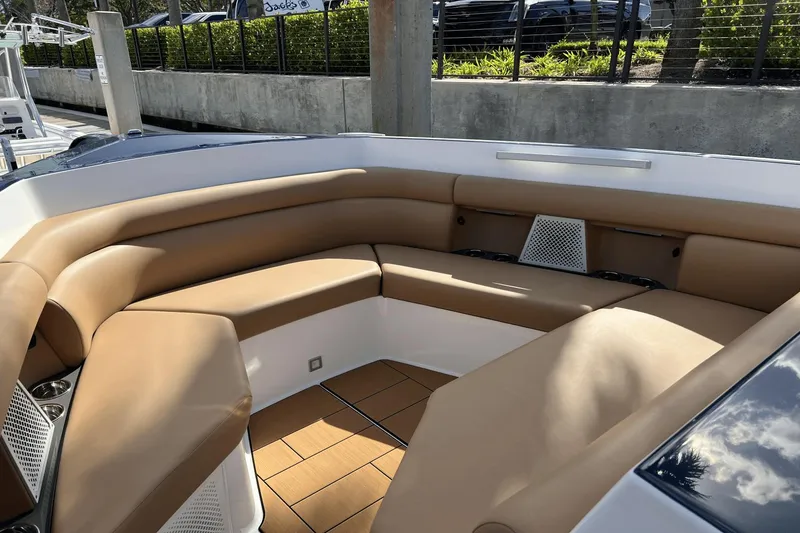 Slide: The Image of 2024 Aviara AV40 Outboard boat with tan seating and sleek design. - 25