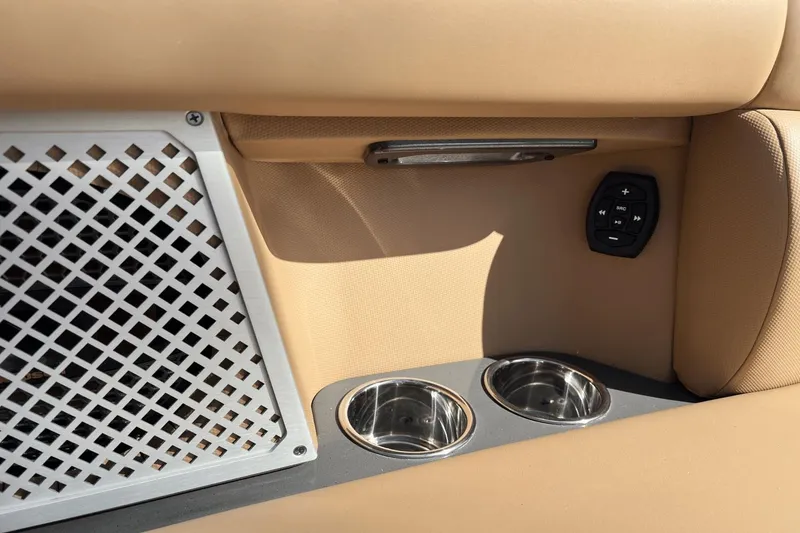 Slide: The Image of 2024 Aviara AV40 Outboard interior with cup holders and control panel. - 26