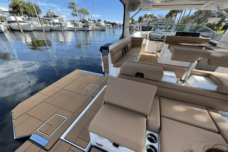 Slide: The Image of 2024 Aviara AV40 Outboard luxury boat interior with spacious seating and waterfront view. - 8