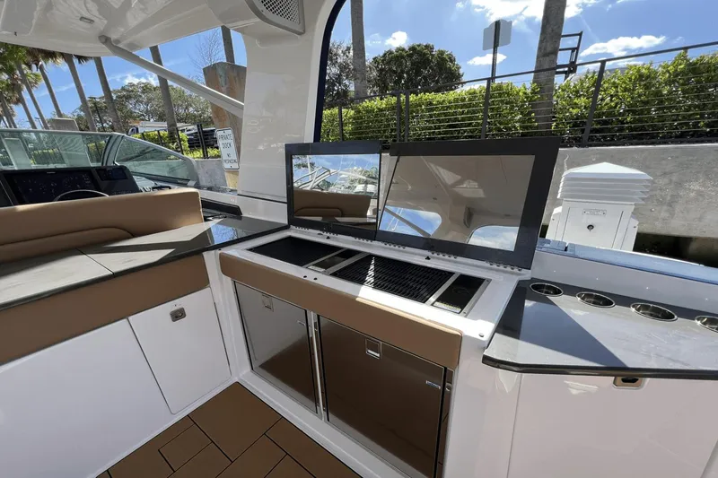 Slide: The Image of 2024 Aviara AV40 Outboard interior with sleek kitchen and modern design. - 9