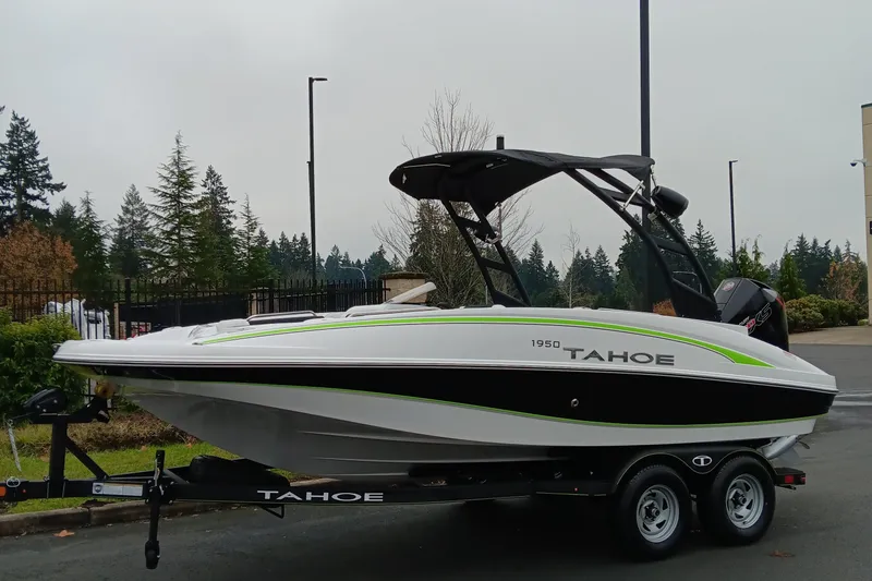 The Image of 2024 Tahoe 1950 boat on trailer, side view, outdoors. - 0
