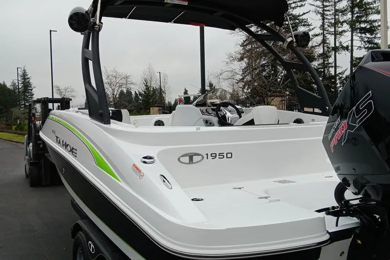 Slide: The Image of 2024 Tahoe 1950 boat with Mercury Pro XS engine, rear view. - 2