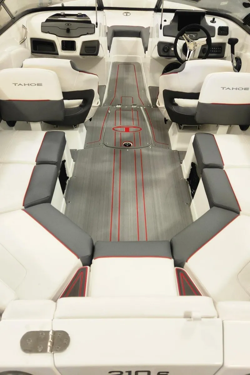 Slide: The Image of 2024 Tahoe 210 S boat interior with white and gray seating. - 11