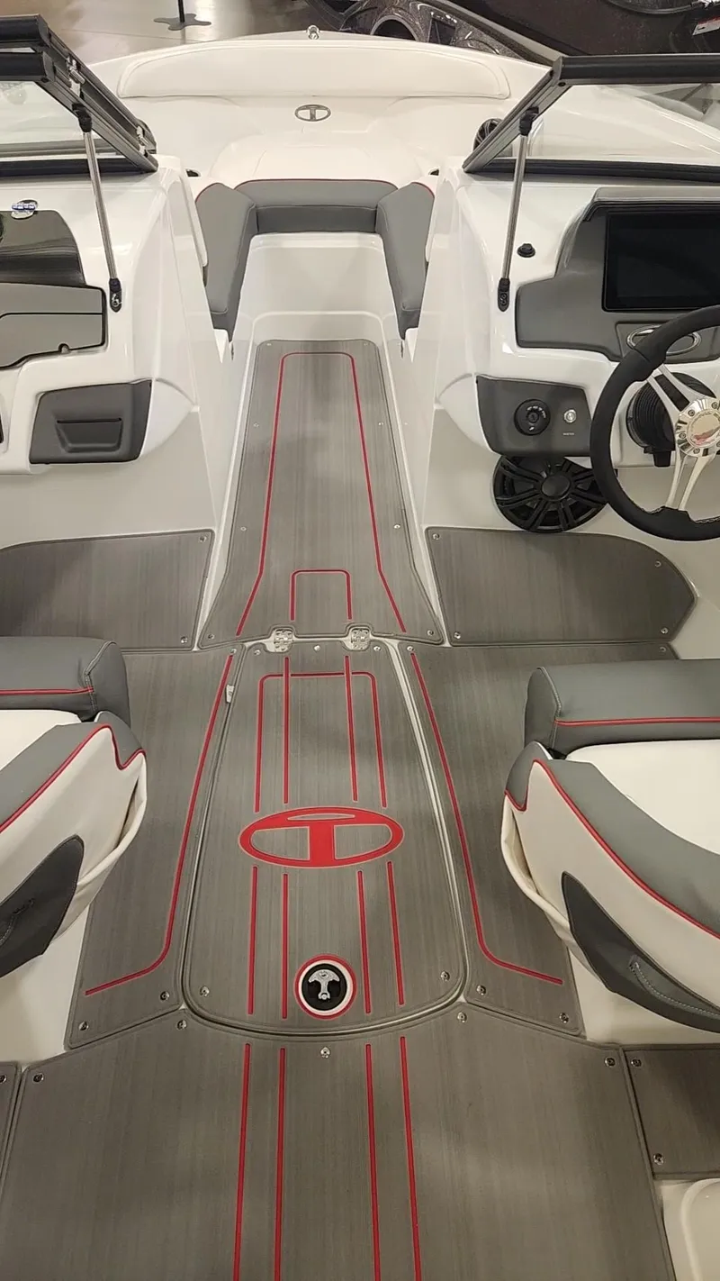 Slide: The Image of 2024 Tahoe 210 S boat interior with modern design and red accents. - 5