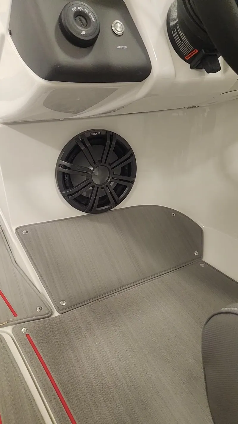 Slide: The Image of 2024 Tahoe 210 S boat interior with speaker and control panel. - 8