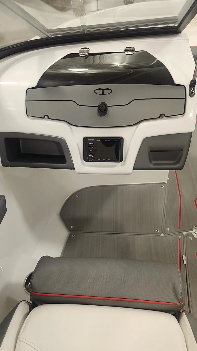 Slide: The Image of 2024 Tahoe 210 S boat dashboard and seating area. - 9